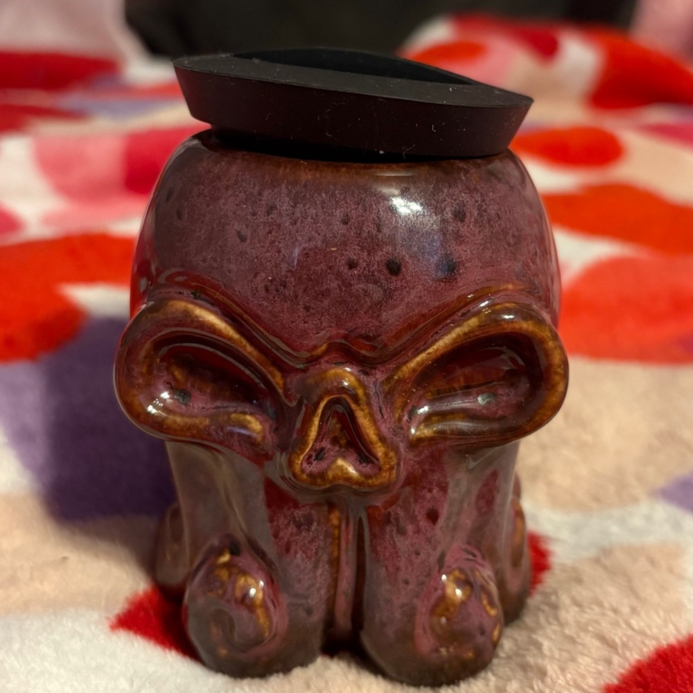 Skull-Shaped Ceramic Home Accent in Purple and Brown